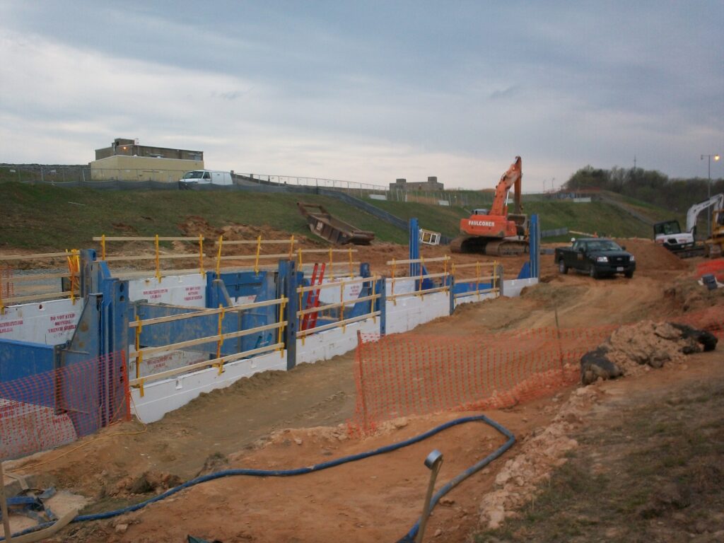 Construction site with orange excavator