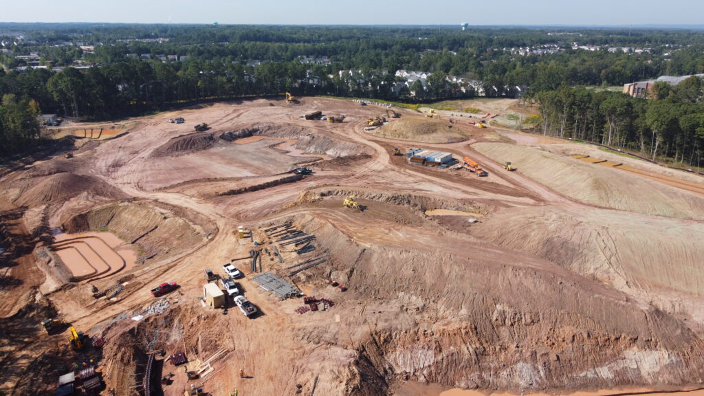 Aerial view of construction site with earthmoving equipment