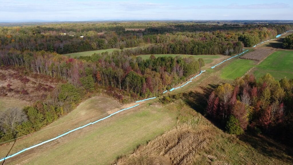 Aerial view of blue pipe laid out on the ground